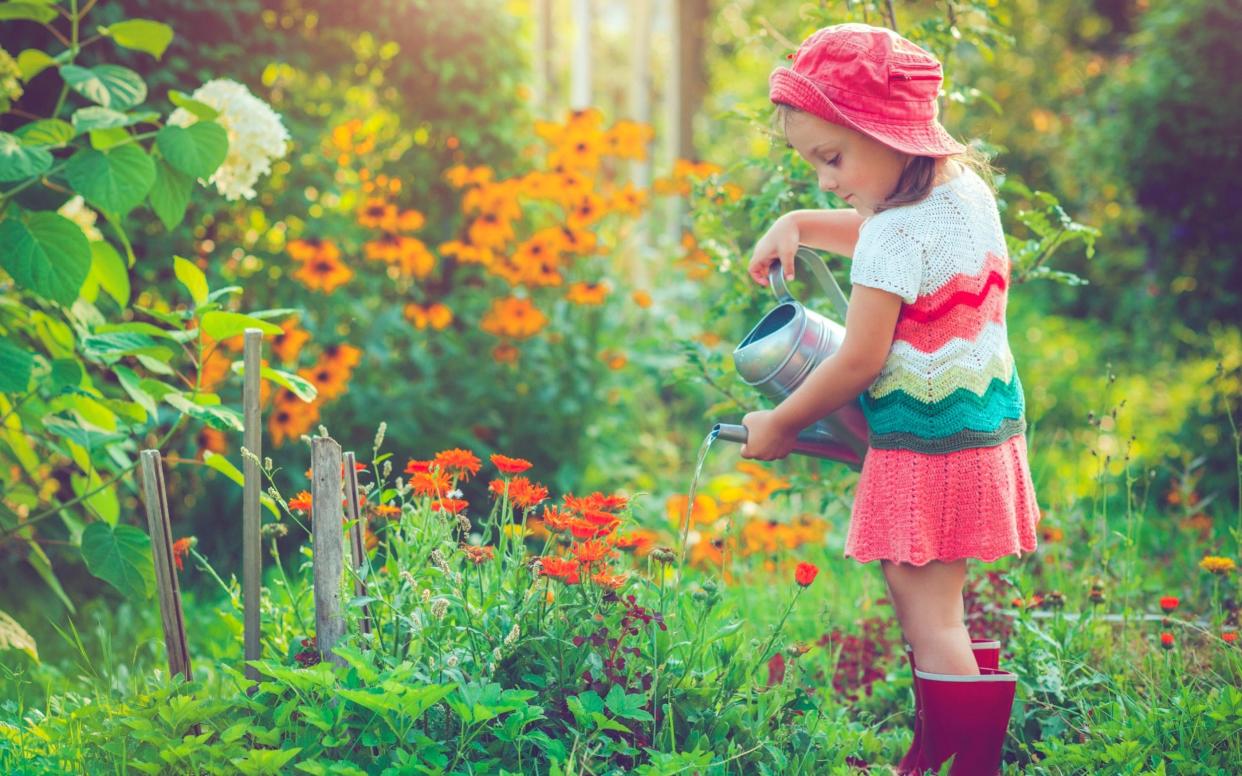 Watering the garden is a skill - ArtMarie / E+