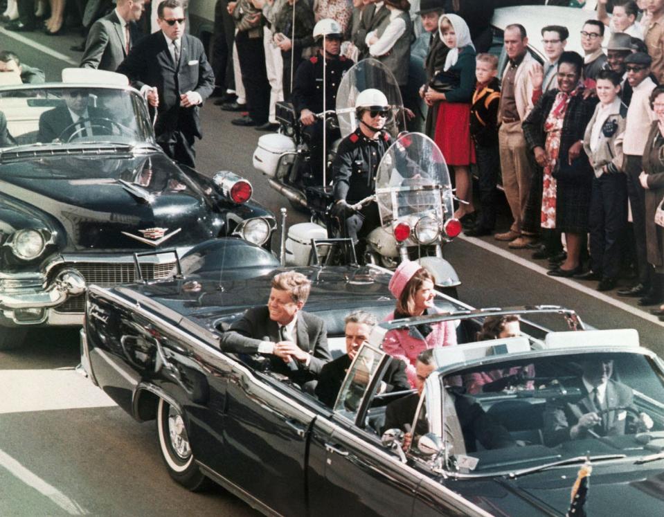 In this Nov. 22, 1963 file photo, President John F. Kennedy's motorcade travels through Dallas. (AP Photo/PRNewsFoto/Newseum, File)