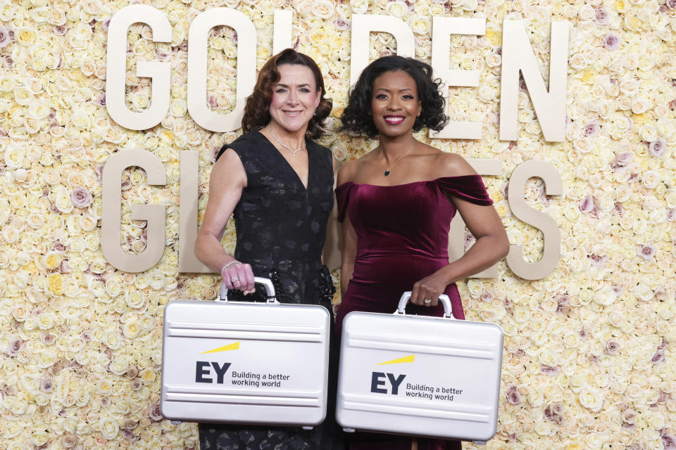 Representatives of Ernst & Young arrive at the 81st Golden Globe Awards on Sunday, Jan. 7, 2024, at the Beverly Hilton in Beverly Hills, Calif. (Photo by Jordan Strauss/Invision/AP)
