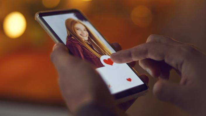 Person tapping on a phone screen