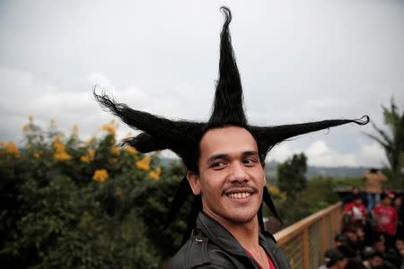 A punk community member enjoys a punk music festival in Bandung, Indonesia West Java province, March 23, 2017. Picture taken March 23, 2017. REUTERS/Beawiharta