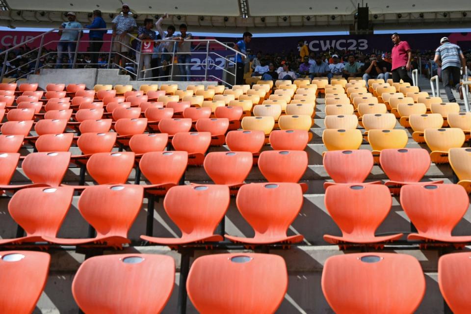 Spectators watch the 2023 ICC men's cricket World Cup one-day international (ODI) match between England and New Zealand at the Narendra Modi Stadium in Ahmedabad on 5 October 2023 (AFP via Getty Images)