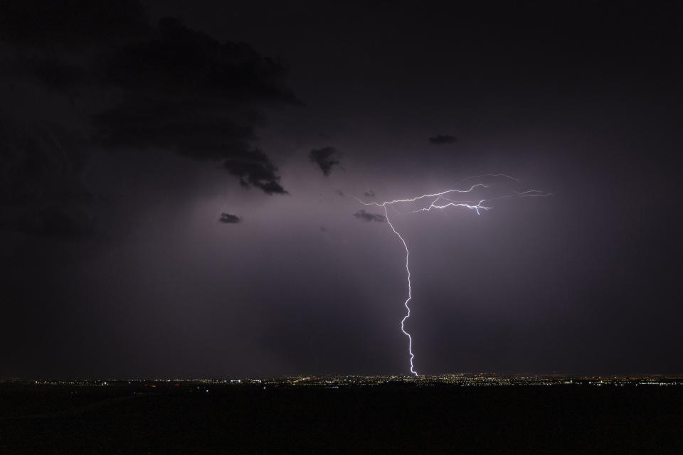 Lightning strikes across the skyline on Thursday, July 28, 2022, in Las Vegas. (L.E. Baskow/Las Vegas Review-Journal via AP)
