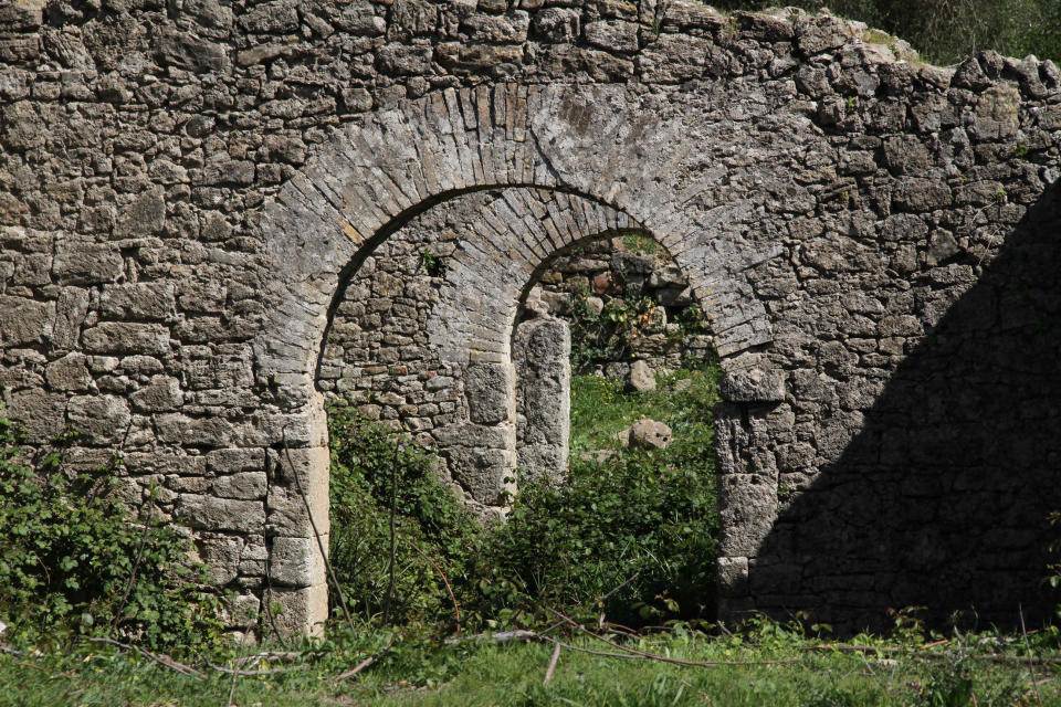 This March 11, 2012 photo shows arches from an olive merchant's factory in the lower city of the Roman ruins of Lixus in northern Morocco. (AP Photo/Paul Schemm)