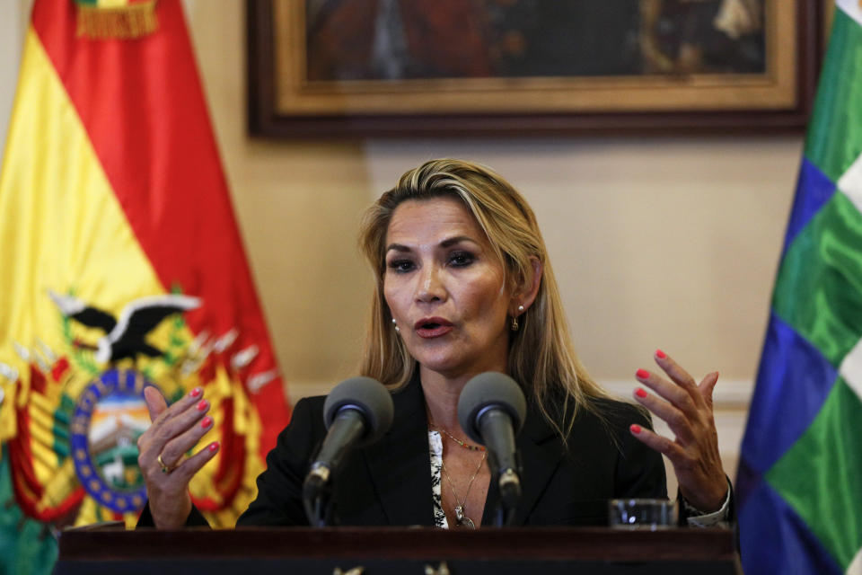 Bolivia's interim President Jeanine Anez speaks during a press conference at the presidential palace, in La Paz, Bolivia, Wednesday, Nov. 13, 2019. The new interim president faces the challenge of stabilizing the nation and organizing national elections within three months at a time of political disputes that pushed former President Evo Morales to fly off to self-exile in Mexico after 14 years in power. (AP Photo/Juan Karita)