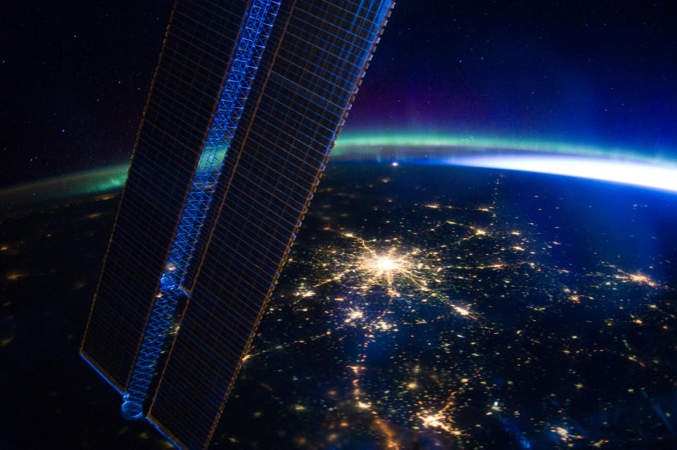 The bright lights of Russia's capital city Moscow are seen beneath the colourful rays of the aurora borealis. The image was recently captured by astronauts on board the International Space Station flying at an altitude of approximately 240 miles.