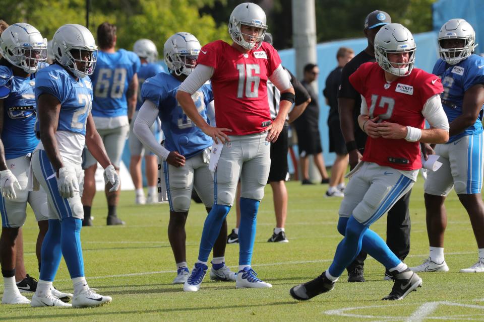 Detroit Lions quarterbacks Jared Goff and Tim Boyle go through drills during training camp Tuesday, August 3, 2021. 