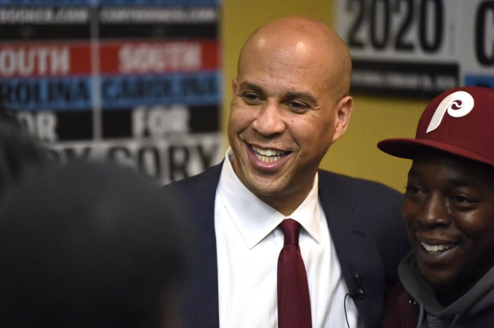 Democratic presidential contender Cory Booker poses for photos after a black men's round table on Monday, Dec. 2, 2019, in Columbia, S.C. (AP Photo/Meg Kinnard)