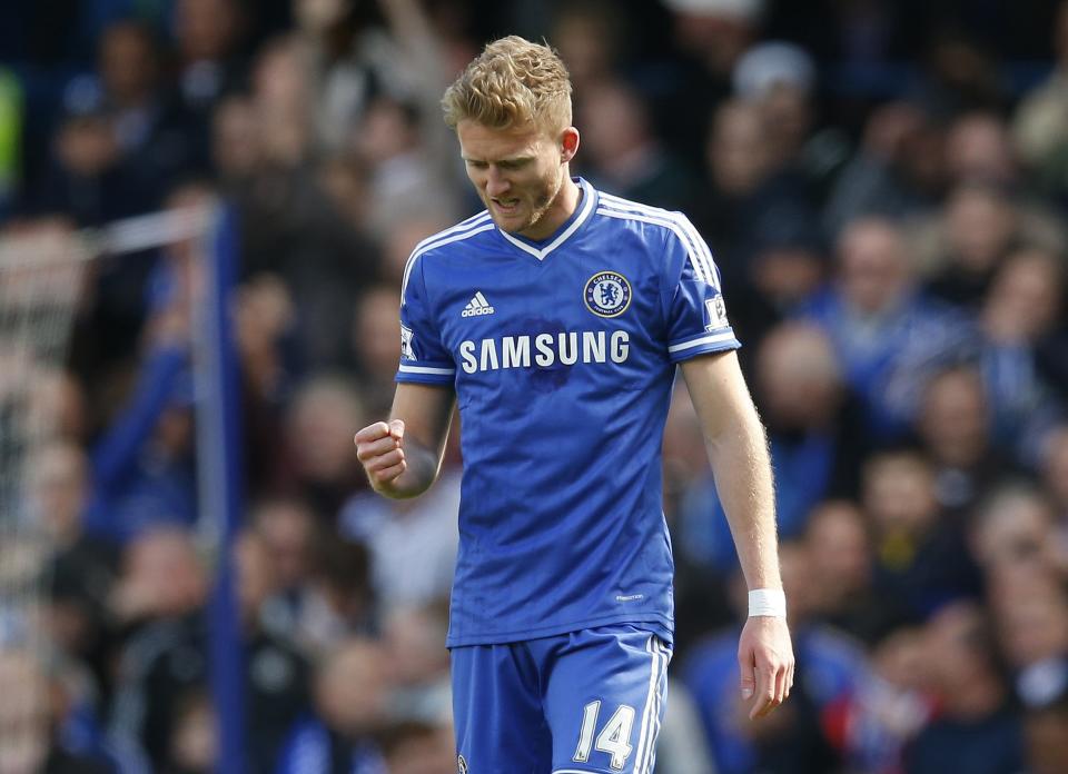 Chelsea's Schurrle celebrates after scoring a goal against Arsenal during their English Premier League soccer match at Stamford Bridge in London