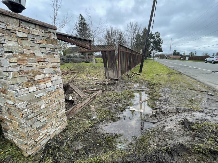 The gunman crashed his car into a deputy’s patrol car and this fence during the pursuit. (KRON4 Photo)