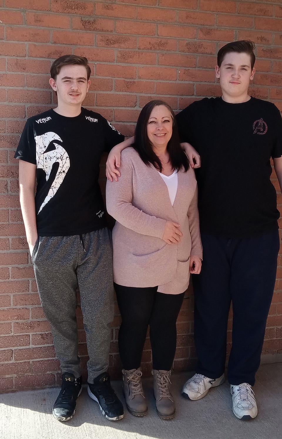 Sandy Gionet with her sons, 15-year-old Mathieu (left) and 12-year-old Michael (right).