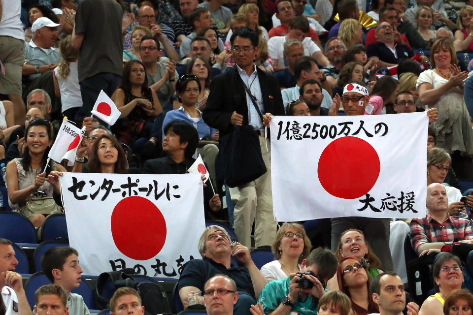 LONDON, ENGLAND - JULY 28: Japanese fans hold up signs during the Artistic Gymnastics Men's Team qualification on Day 1 of the London 2012 Olympic Games at North Greenwich Arena on July 28, 2012 in London, England. (Photo by Ronald Martinez/Getty Images)