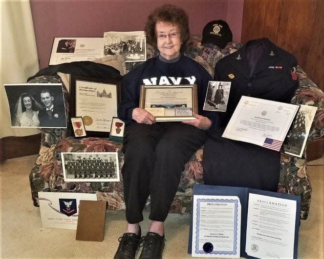 Estelle Leinen is surrounded by memorabilia from her service in the WAVES (Women Accepted for Volunteer Emergency Service) in World War II.