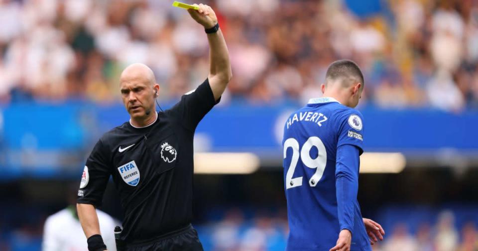 Anthony Taylor is at the centre of the current refereeing 'crisis', here booking Kai Havertz during Chelsea vs Spurs Credit: PA Images