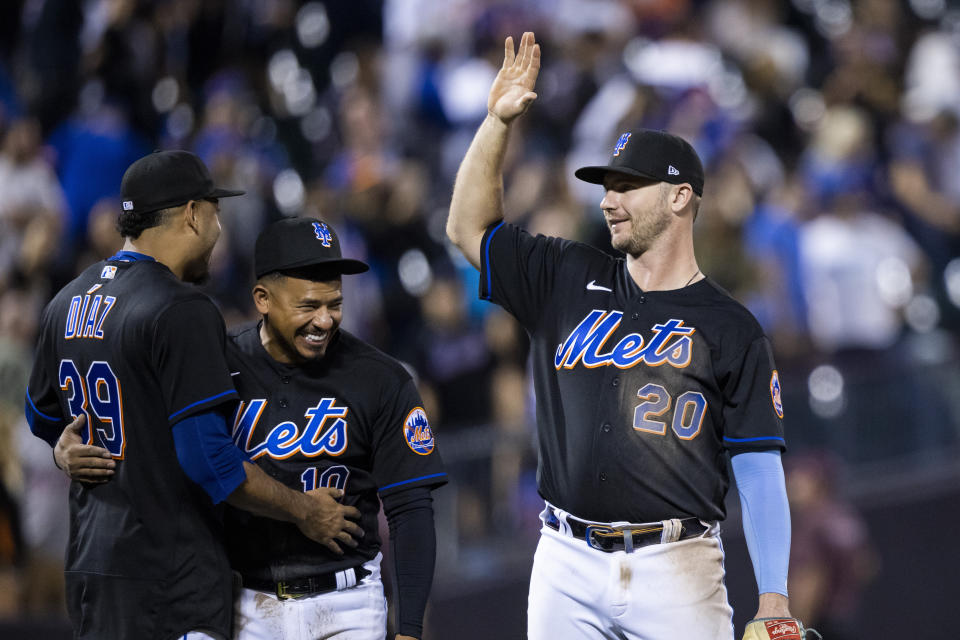 New York Mets Edwin Diaz (39), Eduardo Escobar (10) and New York Mets first baseman Pete Alonso (20) celebrate their win after a baseball game against the Pittsburgh Pirates, Friday, Sept. 16, 2022, in New York. (AP Photo/Corey Sipkin)