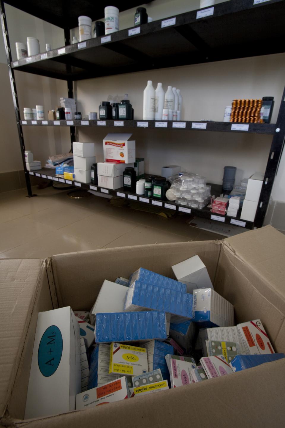 FILE - In this Aug. 27, 2009 file photo, stacks of expired malaria medication are stored in a box at an NGO's village office near Pailin, Cambodia. More than a third of the malaria-fighting drugs tested over the past decade in Southeast Asia and sub-Saharan Africa were either fake or bad quality, seriously undermining efforts to combat the disease, a study said Tuesday, May 22, 2012. (AP Photo/David Longstreath, File)