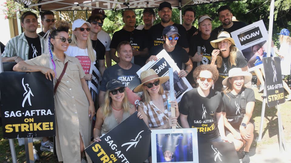 "Glee" castmembers and writers join members and supporters of SAG-AFTRA and WGA on the picket line on August 23, 2023 in Burbank, California.  - Albert L. Ortega/Getty Images