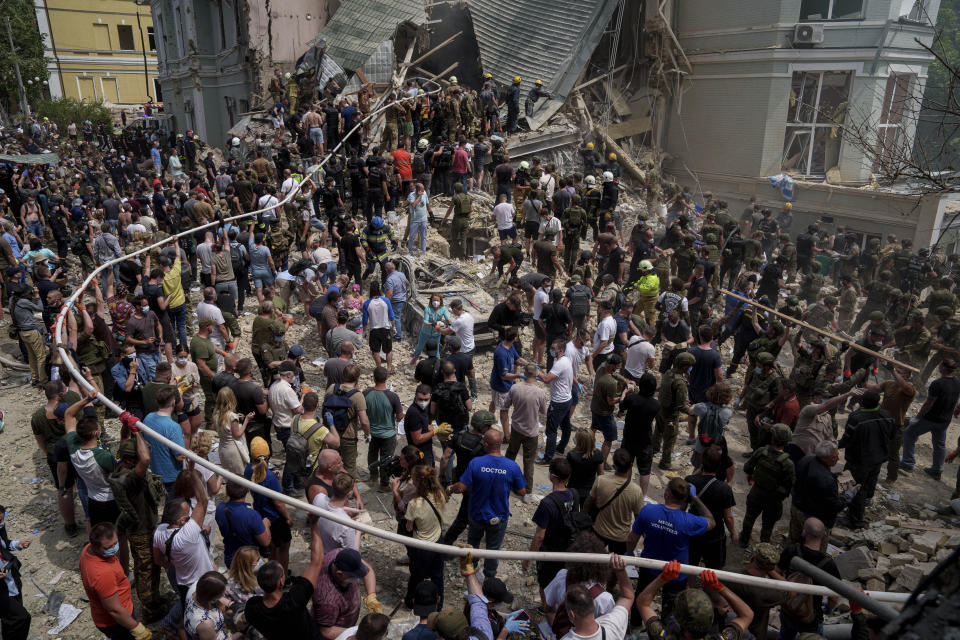 Emergency services work the site of Okhmatdyt children’s hospital hit by Russian missiles, in Kyiv, Ukraine, Monday, July 8, 2024. Russian missiles have killed several people and struck a children’s hospital in the Ukrainian capital, Kyiv, authorities say. (AP Photo/Evgeniy Maloletka)