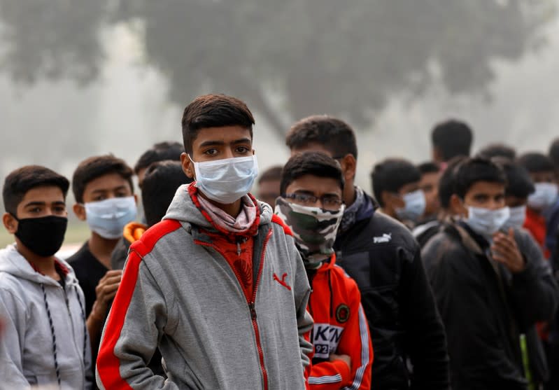 Children wear masks on a smoggy morning in New Delhi
