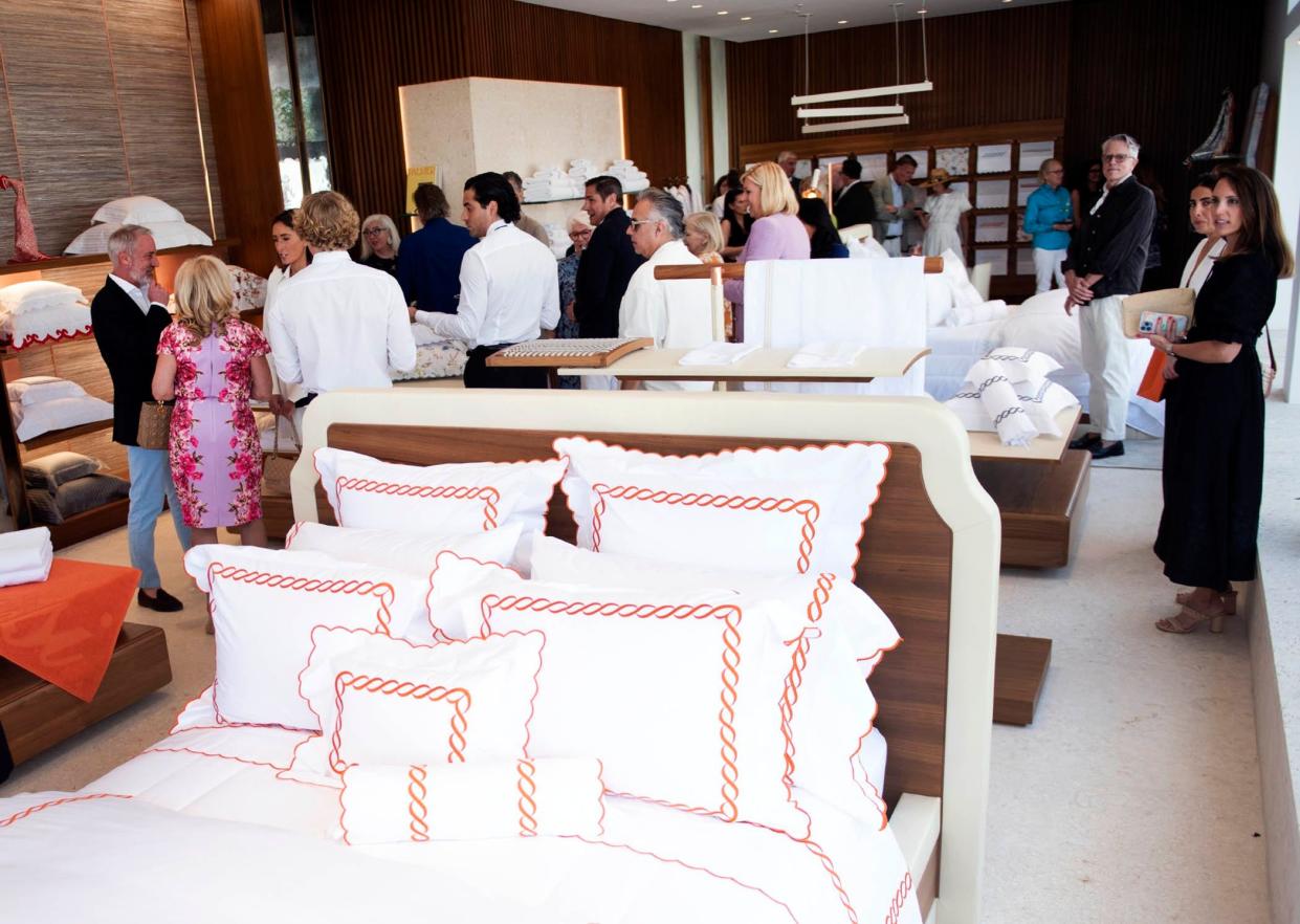 Dozens attend the Pratesi grand opening March 14. The Italian fine linens store returned to Palm Beach after a five-year absence.