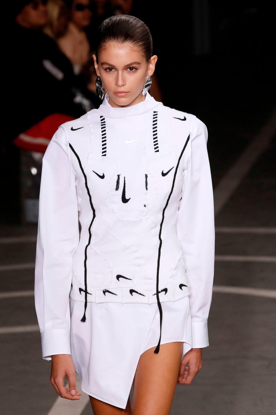 Kaia Gerber walking the runway in an Off-White dress.