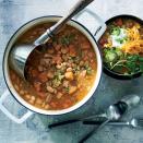 <p>This slow-cooker chicken chili is a great addition to your cool weather weeknight meal rotation. Calling for a mixture of beans and hominy, this recipe boasts bold, rich flavor, something that can often be dulled in a slow cooker. Processing some of the beans in a food processor thickens the soup, lending a heartier flavor to the dish. We suggest serving the soup with green onions, cheese, cilantro, peppers, and plain yogurt, a great substitute for sour cream. Perfect for a tailgate, ideal for cool weather, and guaranteed to make your home smell amazing while you're gone, this slow cooker chili is sure to make your "must make again" list.</p>