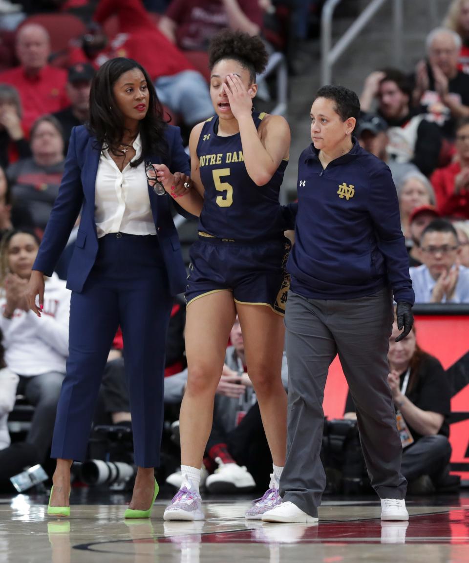 Notre Dame's Olivia Miles tore her ACL last season against the host Cardinals. She is scheduled to return this season.
