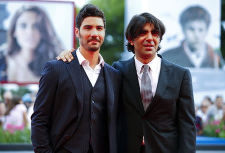 Director Fatih Akim (R) and cast member Tahar Rahim pose during the red carpet for the movie "The Cut" at the 71st Venice Film Festival August 31, 2014. REUTERS/Tony Gentile