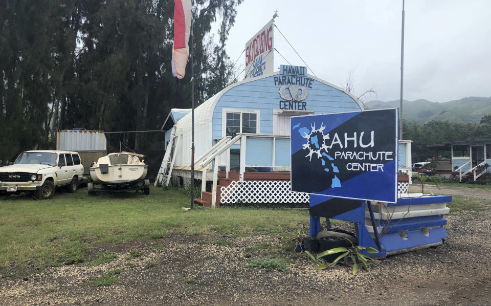 FILE - This June 28, 2019 file photo, shows the Oahu Parachute Center near Dillingham Airfield in Waialua, Hawaii. Federal officials released documents Wednesday, Oct. 28, 2020 that provide details about the 2019 crash that killed 11 people in Hawaii. The public docket contains reports from a National Transportation and Aviation Administration investigation into the crash. (AP Photo/Caleb Jones, File)