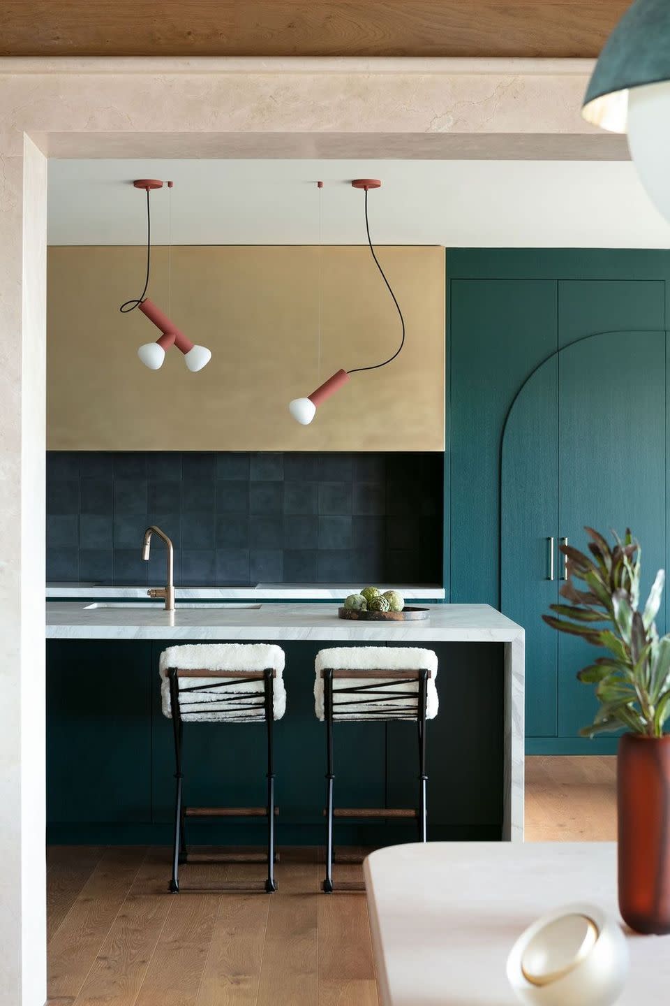 a bathroom with a sink and stools