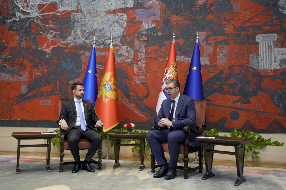Montenegro's President Jakov Milatovic, left, speaks during talks with his Serbian counterpart Aleksandar Vucic at the Serbia Palace in Belgrade, Serbia, Monday, July 10, 2023. Milatovic is on a two-day official visit to Serbia. (AP Photo/Darko Vojinovic)