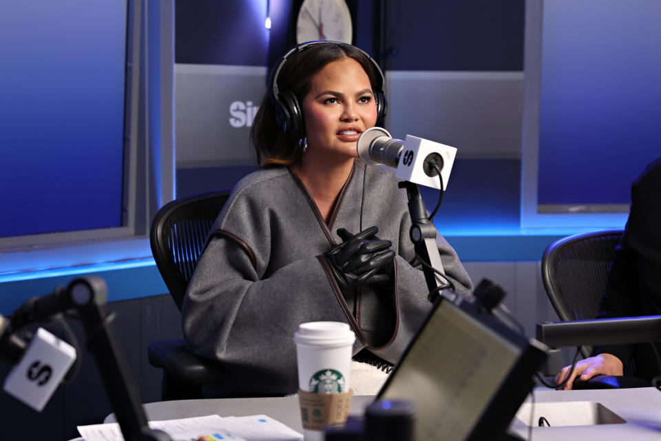 Closeup of Chrissy Teigen on Andy's radio show