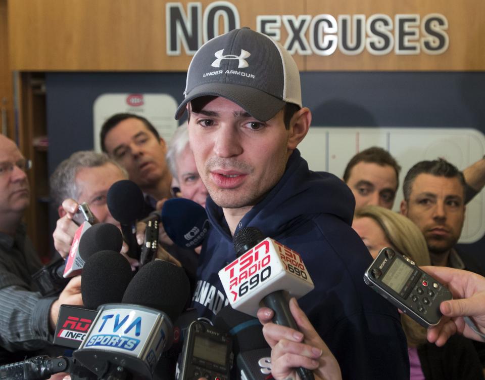 Montreal Canadiens goalie Carey Price speaks to reporters at NHL hockey practice Tuesday, Jan. 7, 2014, in Brossard, Quebec. Price was named to Canada's Olympic hockey team on Tuesday. (AP Photo/The Canadian Press, Ryan Remiorz)