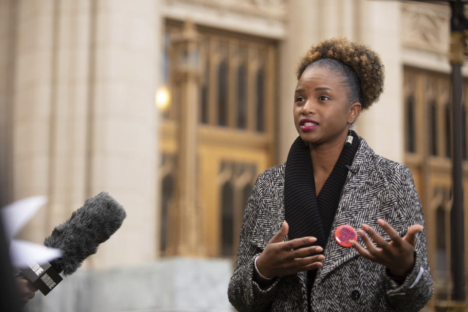 Britney Whaley, one of the organizers of a petition to "Stop Cop City," discusses Atlanta's planned public safety training center on Thursday, Nov. 30, 2023, in front of Atlanta City Hall. Opponents say they collected 116,000 signatures to force a citywide referendum on the training center, but analysis of petition entries by four news organizations found only about 108,500 signatures. It's unclear whether petitioners have enough valid entries, with nearly half the entries unable to be matched to eligible registered Atlanta voters. (Riley Bunch/Atlanta Journal-Constitution via AP)