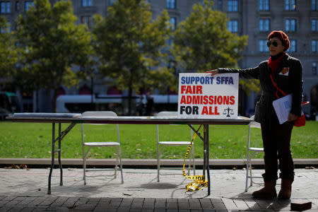 A supporter attends the "Rally for the American Dream - Equal Education Rights for All," ahead of the start of the trial in a lawsuit accusing Harvard University of discriminating against Asian-American applicants, in Boston, Massachusetts, U.S., October 14, 2018. REUTERS/Brian Snyder