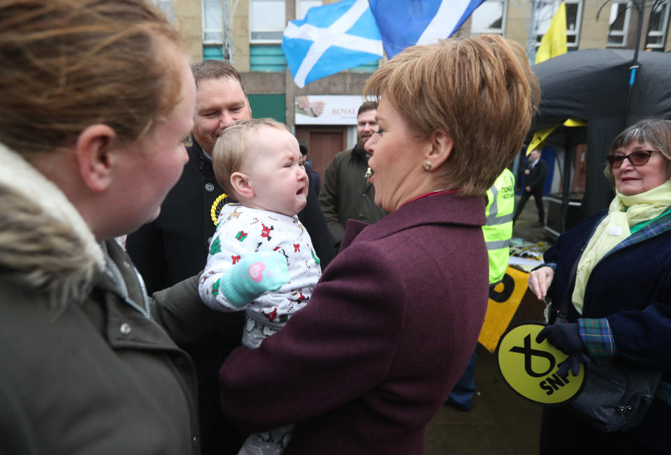 SNP leader Nicola Sturgeon holds a baby in Dalkeith, while on the General Election campaign trail in Scotland. PA Photo. Picture date: Wednesday December 4, 2019. See PA story POLITICS Election . Photo credit should read: Andrew Milligan/PA Wire