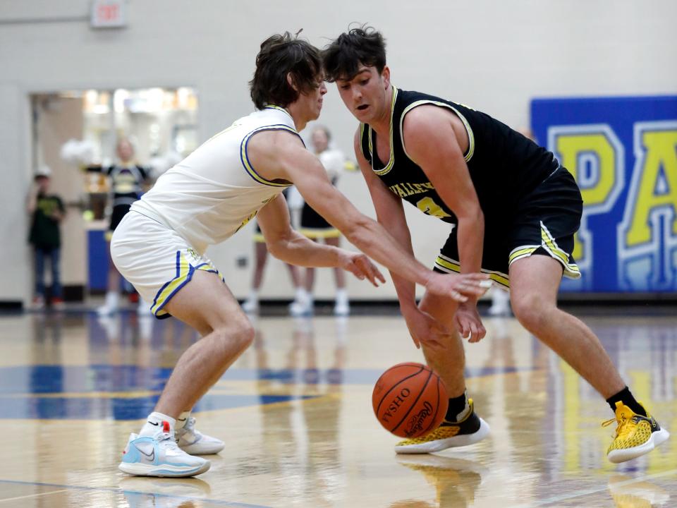 Alex Bobb, left, and Max Lyall go after a loose ball during Maysville's 57-46 win against visiting Tri-Valley on Friday night in Newton Township.