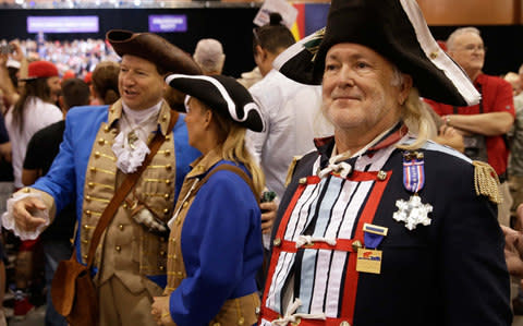 Trump supporters await the start of U.S. President Donald Trump's campaign rally in Phoenix - Credit: Reuters