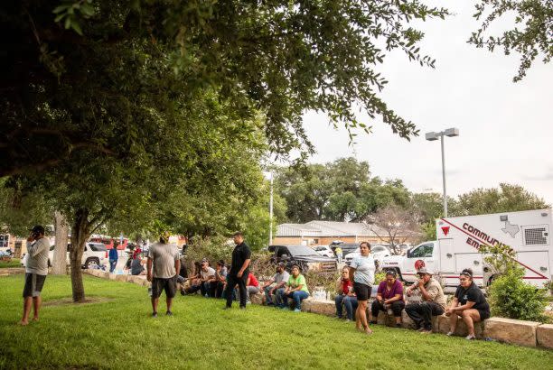 Community members anxiously wait to hear updates about family members outside Uvalde’s SSGT Willie de Leon Civic Center on Tuesday. (Sergio Flores for The Texas Tribune)