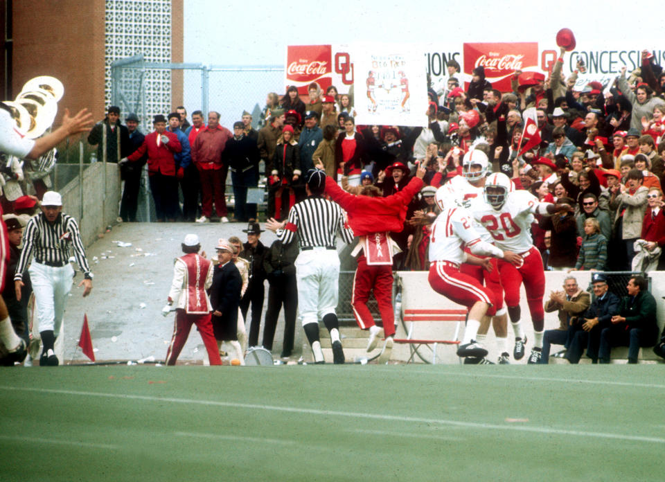 FILE - In this Nov. 25, 1971, file photo, Nebraska's Johnny Rodgers (20) celebrates in the end zone after his long punt return against Oklahoma in Norman, Okla., on Thanksgiving Day. The game on Thanksgiving 50 years ago is back in the spotlight as Nebraska and Oklahoma renew their rivalry on Saturday, Sept. 18, 2021. (Lincoln Journal Star via AP, File)