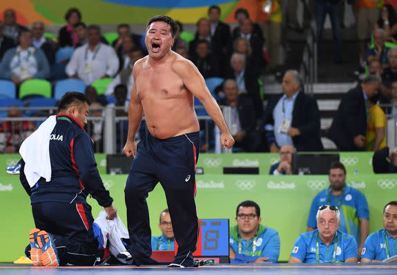 Mongolia's Mandakhnaran Ganzorig's coach reacts after the judges announced that Uzbekistan's Ikhtiyor Navruzov won following a video replay in their men's 65kg freestyle bronze medal match on August 21, 2016, during the wrestling event of the Rio 2016 Olympic Games at the Carioca Arena 2 in Rio de Janeiro. / AFP / Toshifumi KITAMURA        (Photo credit should read TOSHIFUMI KITAMURA/AFP/Getty Images)