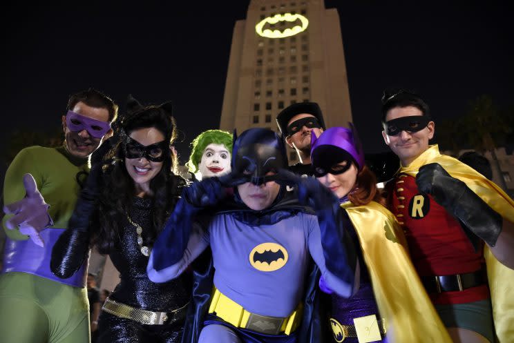 Bat signal... fans flocked to the City Hall in Los Angeles to see the Bat Signal turned on in memory of Adam West - Credit: AP