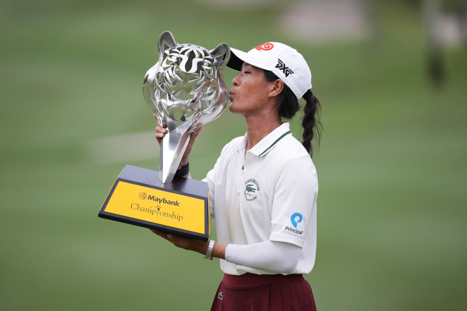 Celine Boutier of France kisses the winner's trophy after winning the final round of the LPGA Maybank Championship in Kuala Lumpur, Malaysia, Sunday, Oct. 29, 2023. (AP Photo/Vincent Thian)