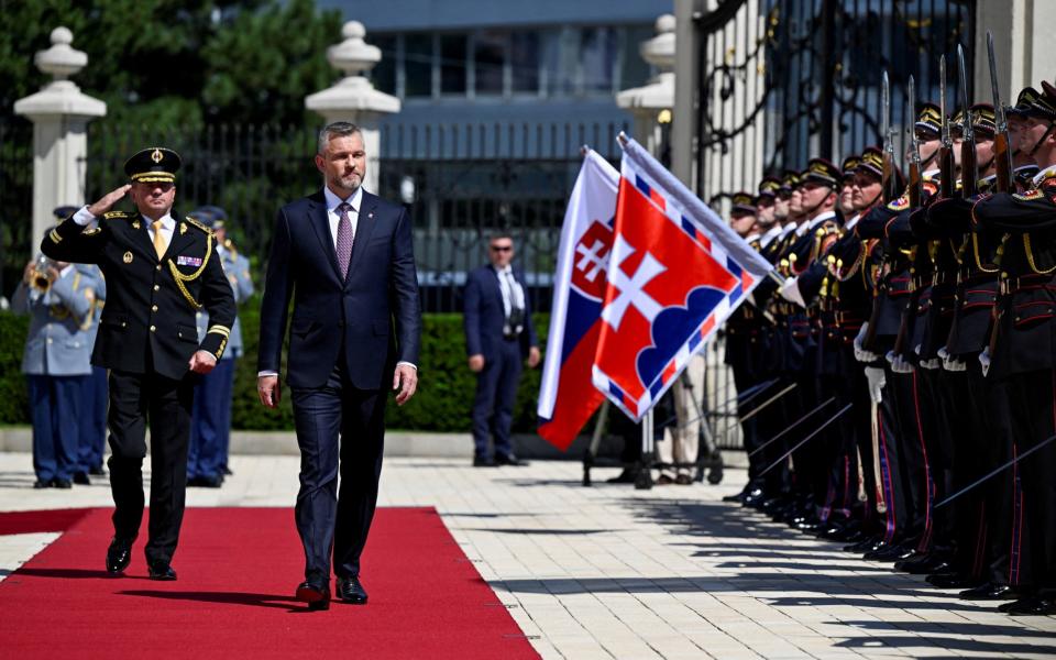 Slovakia's newly elected president Peter Pellegrini reviews the Honour Guard