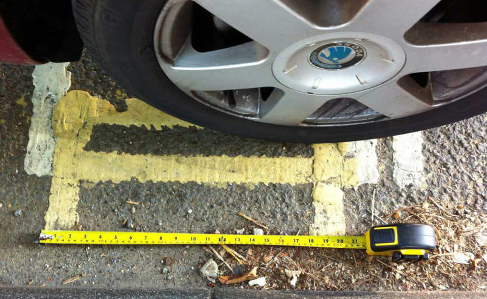 Residents are baffled after council contractors painted a stretch of double yellow lines - just 21 inches long.  Motorists will be fined £50 or £70 if they park on the lines in Canterbury, Kent, which aren't even big enough to park a skateboard.  Picture: SWNS