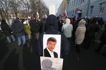 People attend a rally, which marks the third anniversary of Russian opposition politician Boris Nemtsov's death, in Moscow, Russia February 25, 2018. REUTERS/Maxim Shemetov