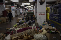 Residents stay in the city subway of Kharkiv, in eastern Ukraine, on Thursday, May 19, 2022. Although the bombings in Kharkiv have decreased and the subway is expected to run beginning of next week, still some residents use it as a temporary bomb shelter. (AP Photo/Bernat Armangue)