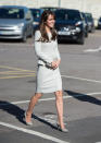 <p>On a visit to a women’s prison, Kate wore a white tweed dress by Fold London and grey Jimmy Choo heels. She also carried a neutral-toned bag by Hobbs. </p><p><i>[Photo: PA]</i></p>