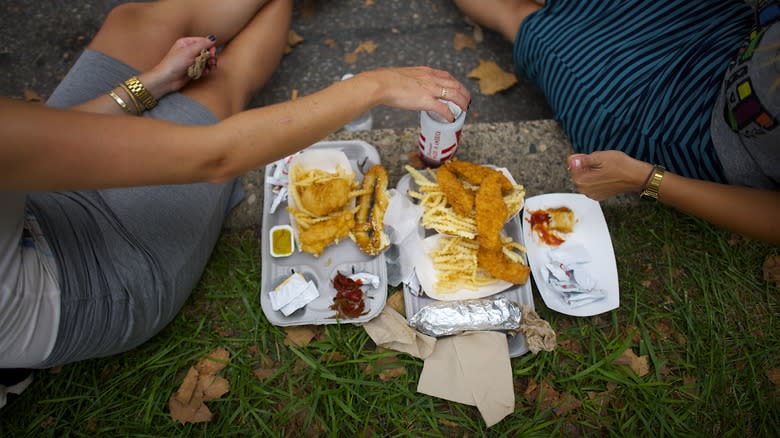 two people enjoying chicken tenders