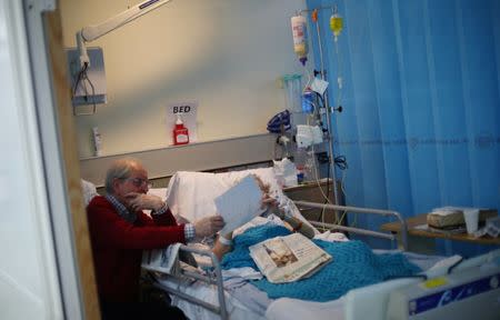 An inpatient talks to her visitor in Ward 8 at Milton Keynes University Hospital in Milton Keynes, central England, Britain, May 23, 2018. REUTERS/Hannah McKay